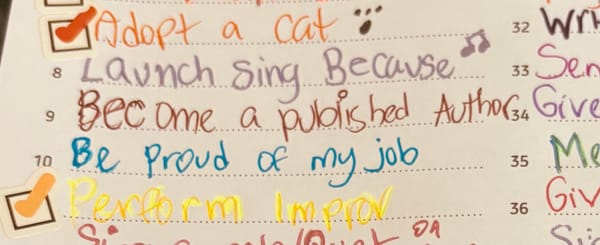 a slightly blurry, cropped photo depicting a partial list of Jen's dreams, scrawled in a variety of colours of gel pen. 